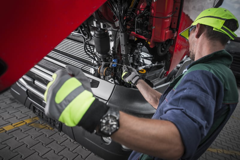 Mechanic performing some truck maintenance