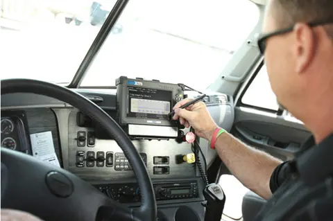 A driver managing their electronic logs on their ELD